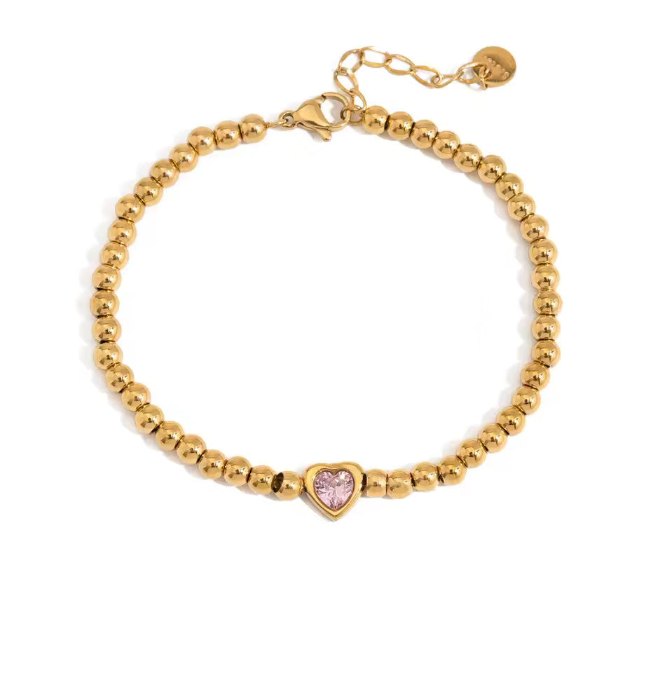 Bracelet Alma en acier inoxydable doré avec cœur rose