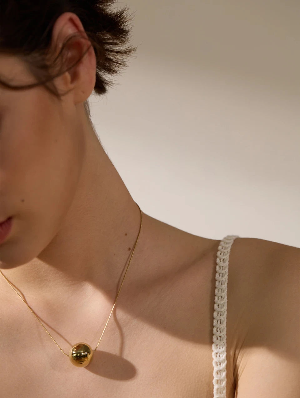 Collier Boule — en acier inoxydable doré