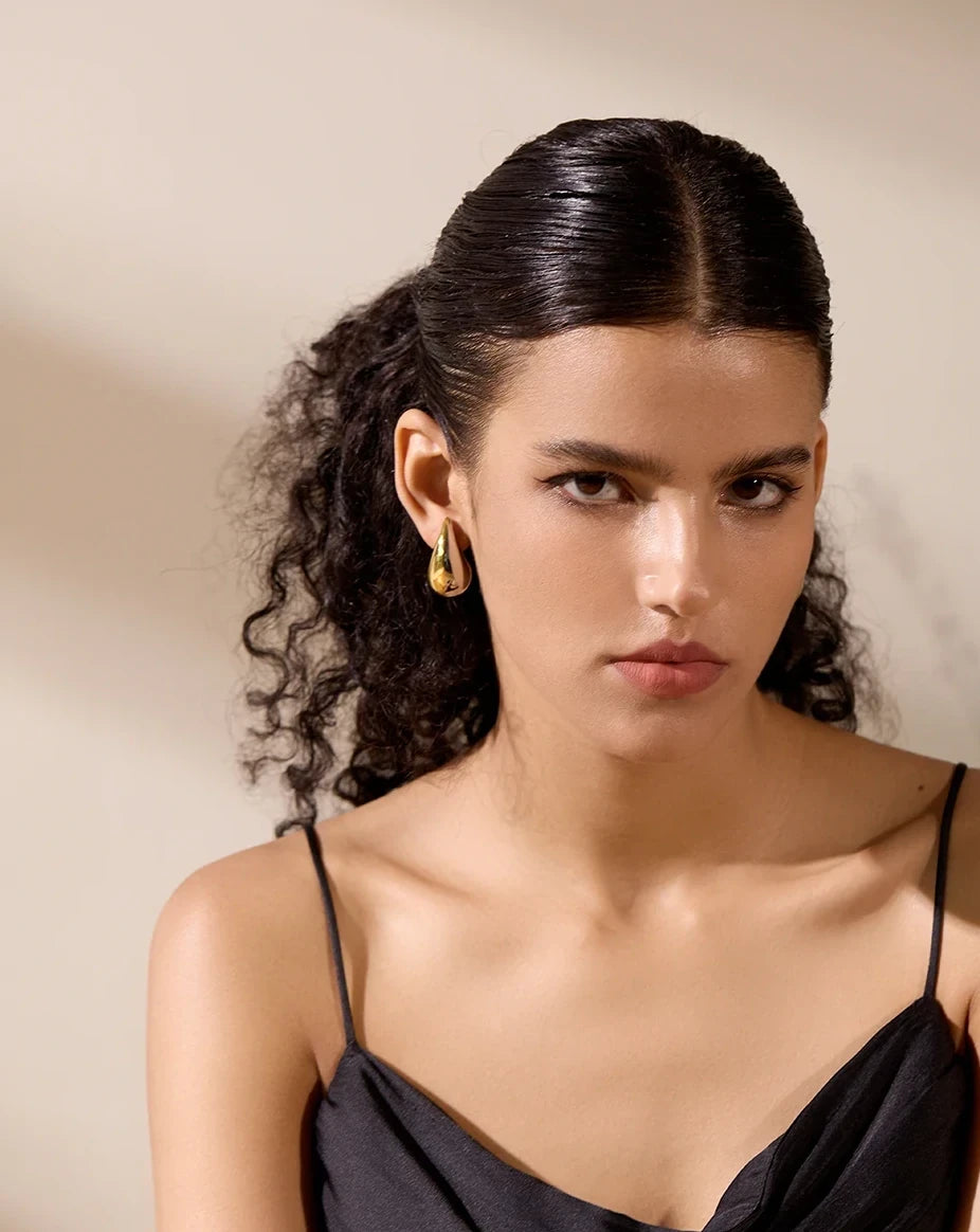 Boucles d’oreilles Goutte sculpturale en acier inoxydable doré