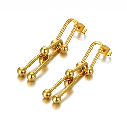 Boucles d’oreilles dorées en acier inoxydable iconique