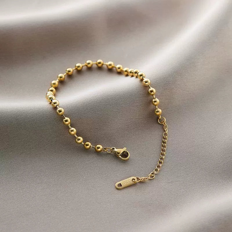 Bracelet Sphères dorées en acier inoxydable doré
