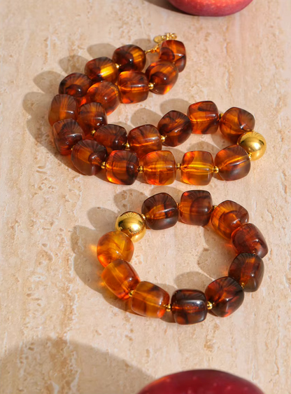Collier Ambre acrylique et acier inoxydable doré